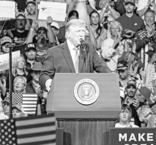 VISITING KANSAS - President Donald Trump addresses a crowd of supporters Monday, Oct. 19, at Heartland Credit Union Arena in Park City, Kansas. Trump visited the state to campaign for U.S. Sen. Roger Marshall and other Republican candidates ahead of the Nov. 3 general election. U.S. Rep. Derek Schmidt was among the Kansas officials attending the rally, where supporters displayed campaign signs and American flags.