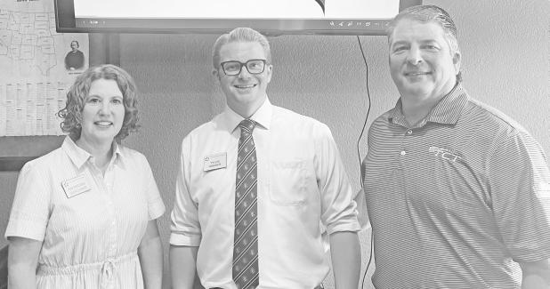 Eisenhower Foundation Director Meredity Sleichter (left) and Director of Development Tyler Habiger (middle) presented the program at the Council Grove Rotary Club on Wednesday. The two discussed the new Education Center being built on the Eisenhower Campus in Abilene. Scott Bankes (right) was responsible for booking the informative program.