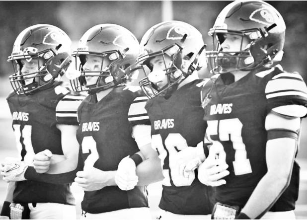 The Council Grove Braves exhibited discipline, confidence and execution Friday night, beating the West Franklin Falcons 66-0. Amber Weeks captured this look of determination in the team’s captains earlier in the night. Pictured left to right are: Bradley Doornbos, Luke Stewart, David McDiffet and Reid Buttrey. Full article on page 4.