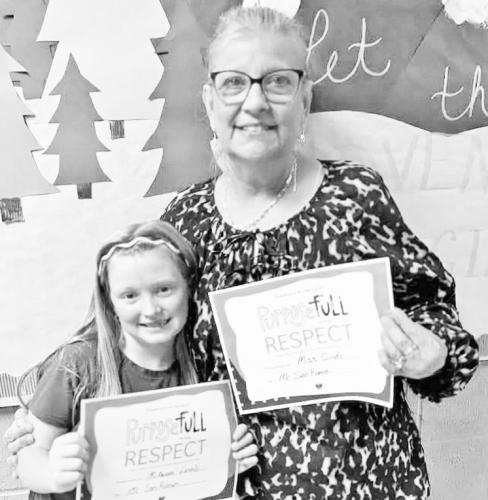 PURPOSEFULL WITH RESPECT -- Student McKenna Lamb (left) and staff Cindy Zimmerman received the PurposeFull with Respect Award at Prairie Heights Elementary School in Alta Vista in recognition of their example of purposeful and respectful behavior.