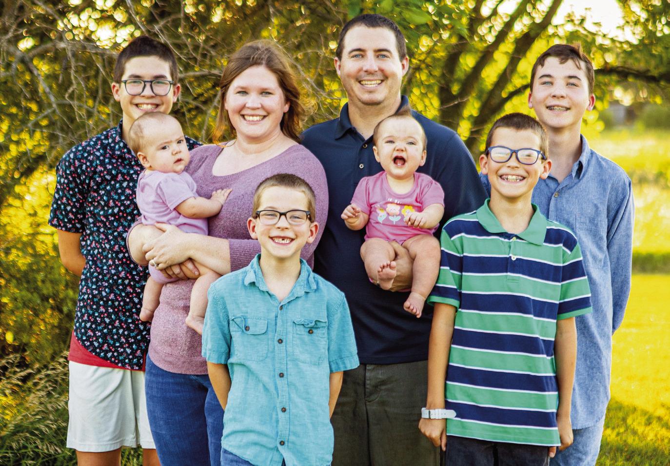 The McIver family has grown by two with the adoption of twins Hannah and Chloe. Pictured left to right, back row: Henry, Melinda, Callahan, Owen, middle: twins Hannah, Chloe, front row: Floyd, Noah.
