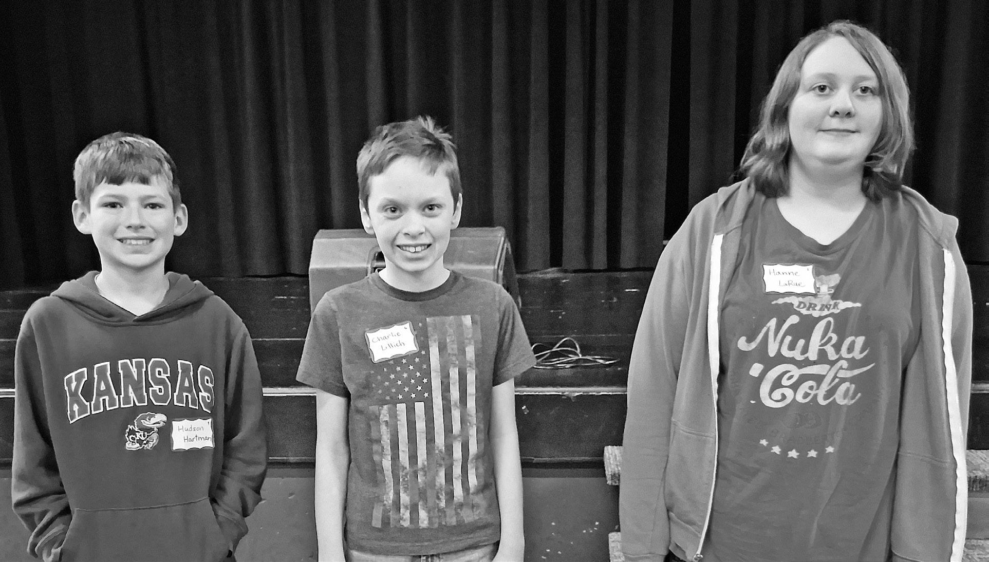 HANNE LARUE COUNTY SPELLING CHAMP -- Hanne LaRue (right), a seventh grade student at Council Grove Junior High, won the Morris County Spelling Bee here Wednesday afternoon. Second place went to Charlie Lillich (middle), Prairie Heights sixth grader, and t