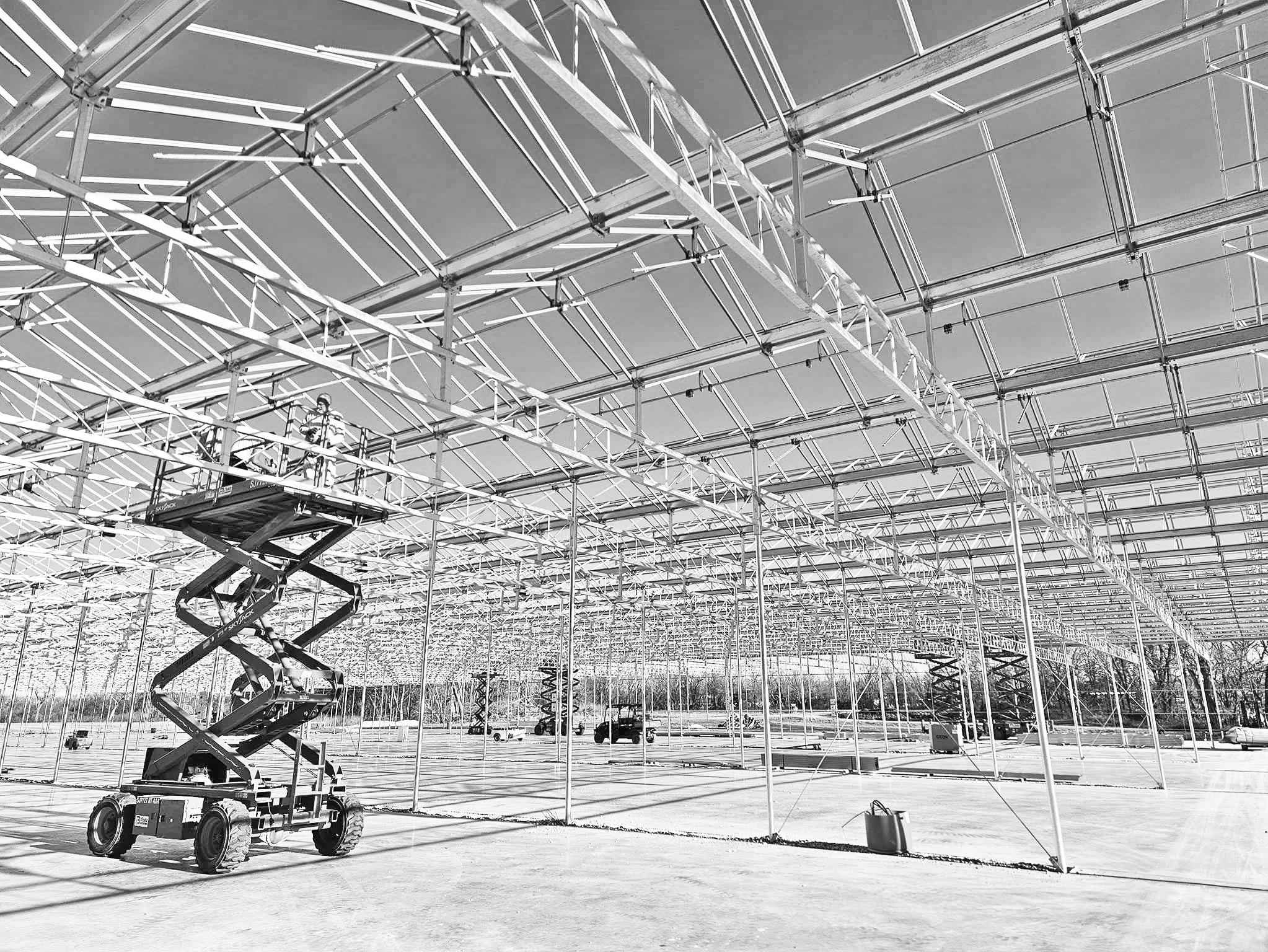ONE BIG OPERATION . . .The latest greenhouse being completed at Neosho Gardens brings the total area of greenhouse space to nearly 800,000 sq. ft. The greenhouse utilizes Holland technology, which owner Eric Nelson said is the best and most efficient in t