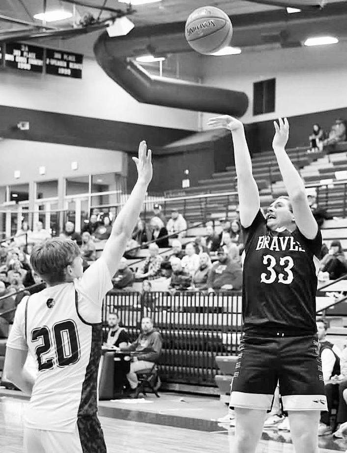 BUTTREY FOR THREE!! -- Council Grove High School junior Reid Buttrey led all scorers Thursday night with 20 points, hitting five three pointers. The Braves would end up losing to Marion 57-45. (Photo by Amber Weeks)