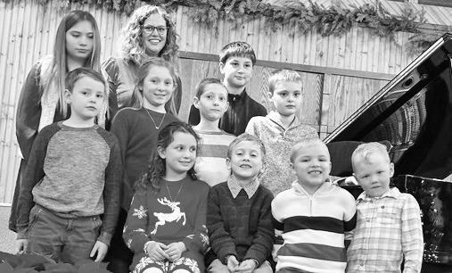 Christmas carols were the focus of Laura Armbrust Piano Students piano recital on Sunday, December 14. Pictured left to right are - Back Row: Lydia Klepper, Laura Armbrust and Asher Kormanik; Middle Row: Wallace Yoder, Ava Butker, Kresten Armbrust and Hen