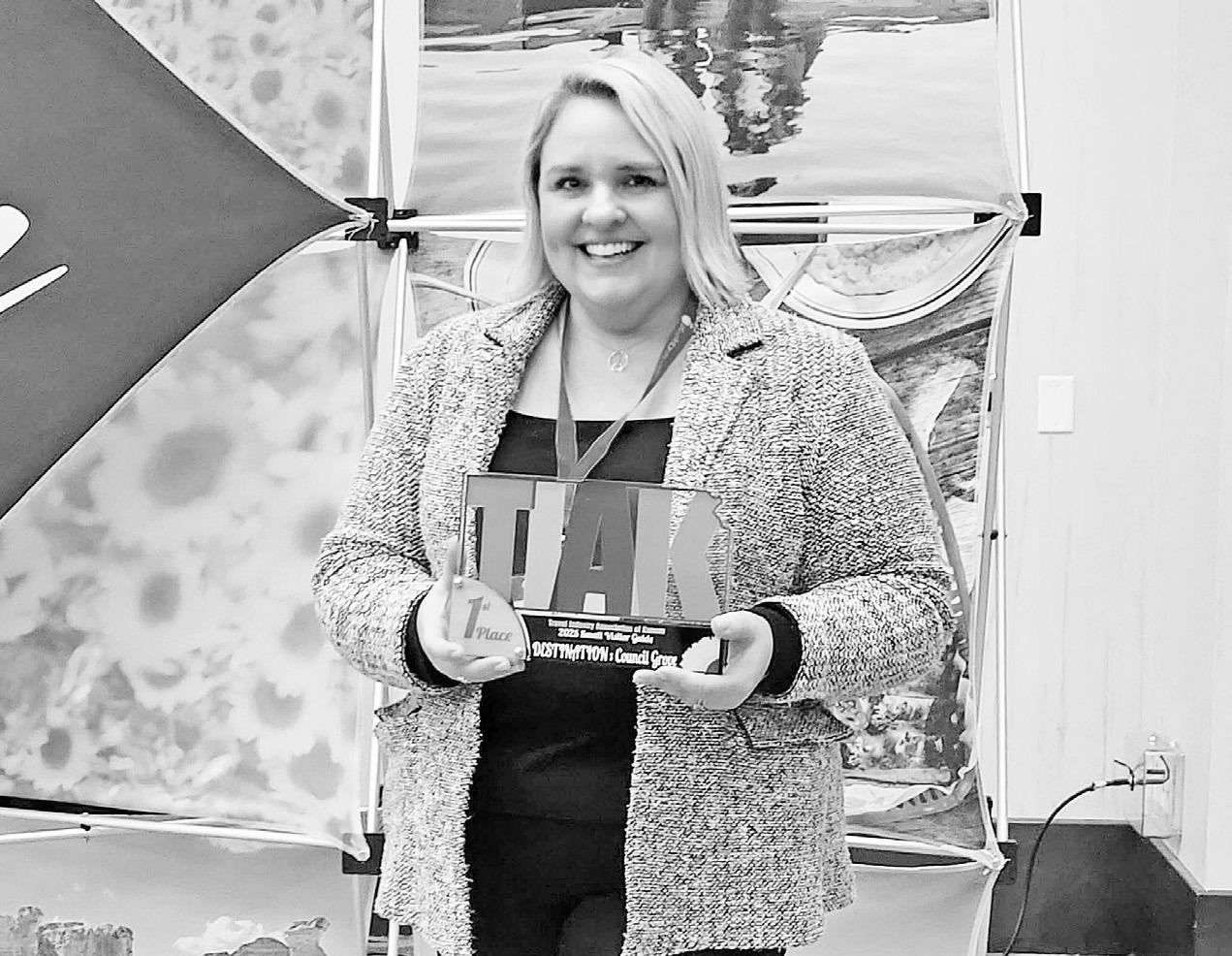 PLACING FIRST . . .Destination : Council Grove won the best small budget visitors guide in Kansas for the second consecutive year at the Kansas Tourism Conference in Manhattan, hosted by the Travel Industry Association of Kansas. Zoey Wadick, CVB and Comm