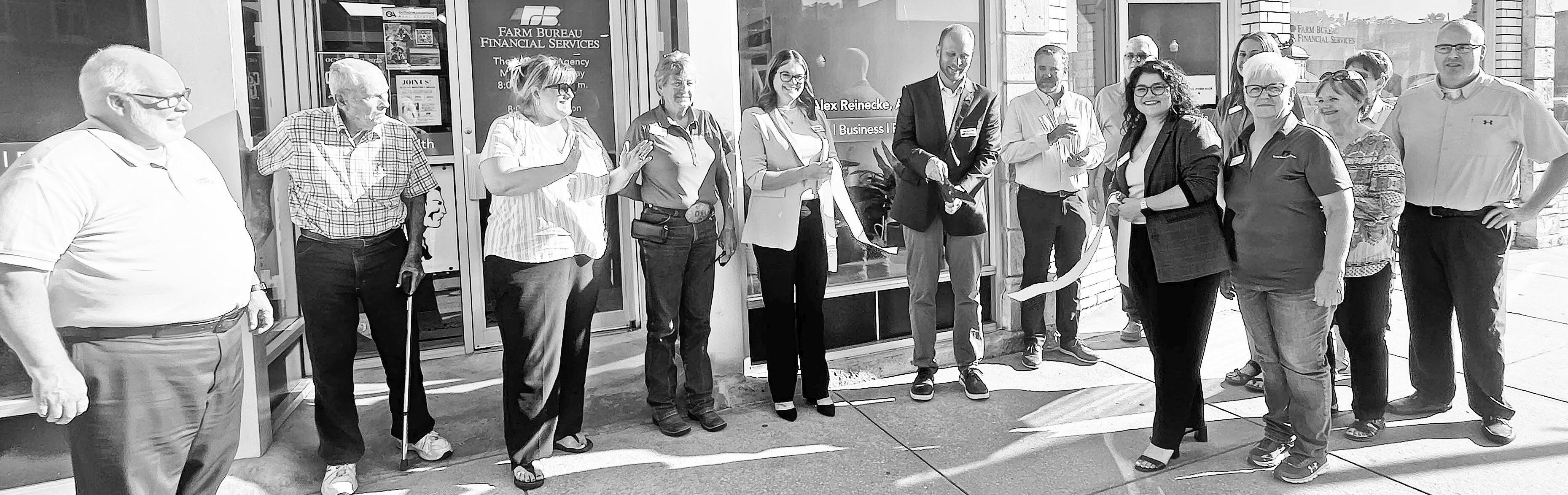 Alex Reinecke of the Reinecke Agency of Farm Bureau Financial Services celebrated his new location of 211 W. Main with a ribbon cutting and open house on Wednesday evening. The event was part of the city’s Monthly Mixer event. A few of the many that wer