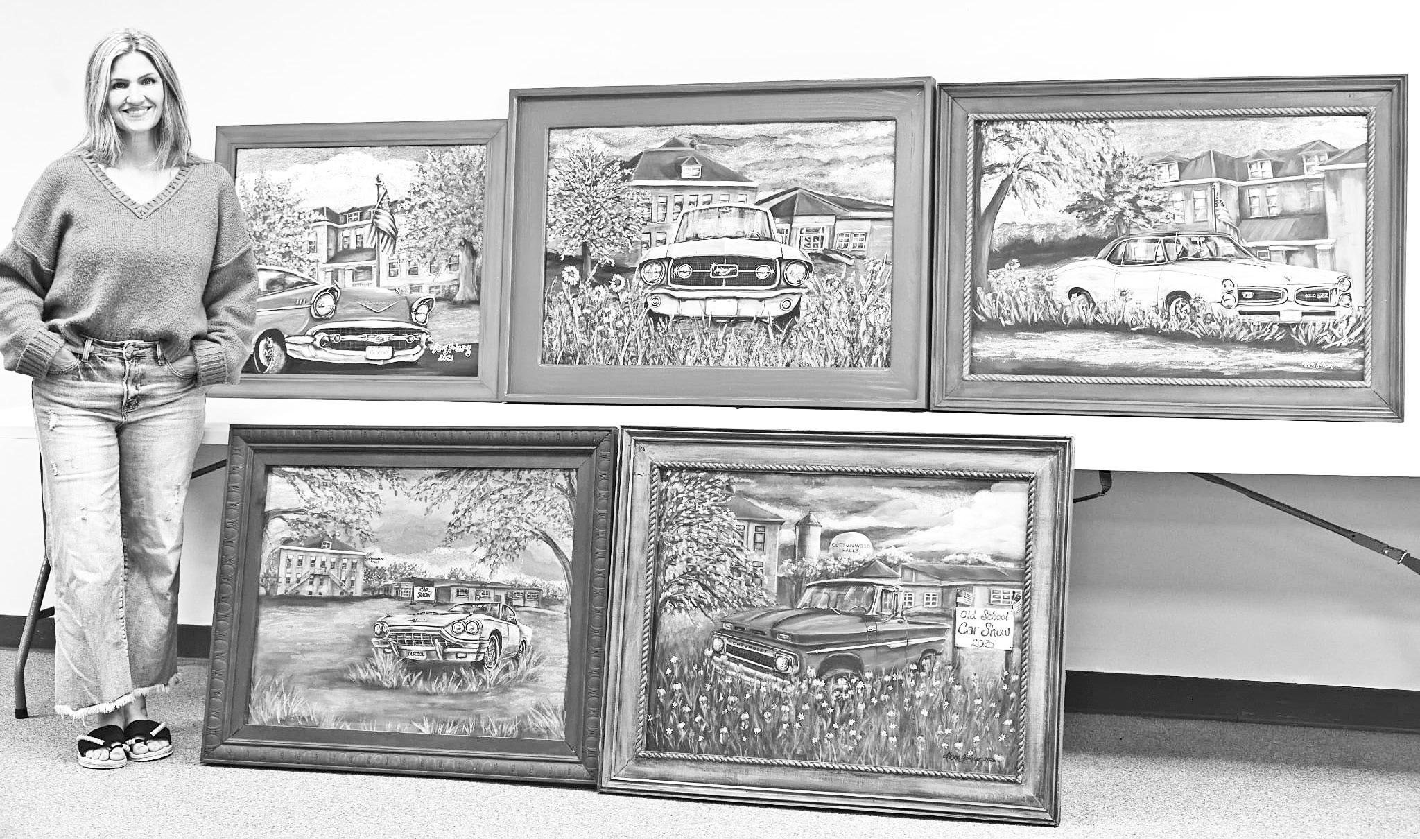 DONATES PAINTINGS -- Local artist Alison Johnson is pictured with five paintings she created that will be featured at the Old School Car Show. She has donated the paintings to the Old School for permanent display.