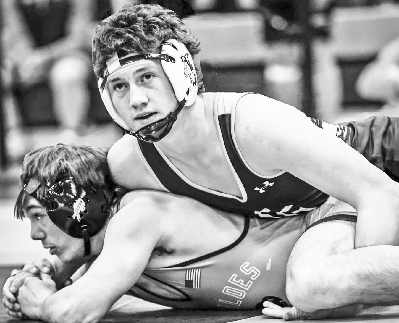 CHAMPION -- Braves senior Cade Honor (33-5) won 2-19 on a tech fall over Monty Meyerekorth of Onaga and went on to win the 165 pound championship. Photo: Amber Weeks