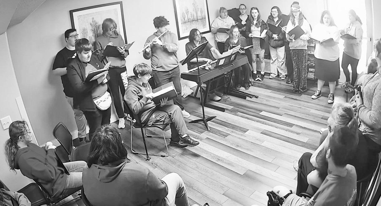 ENTERTAIN RESIDENTS -- Mr. Matthew Meals and his Council Grove Jr/Sr High School Choir performed at Neosho Plaza Apartments on March 11. Aleece Priest, manager of NPA said, “Their beautiful and upbeat songs brought lots of joy and energy to our resident