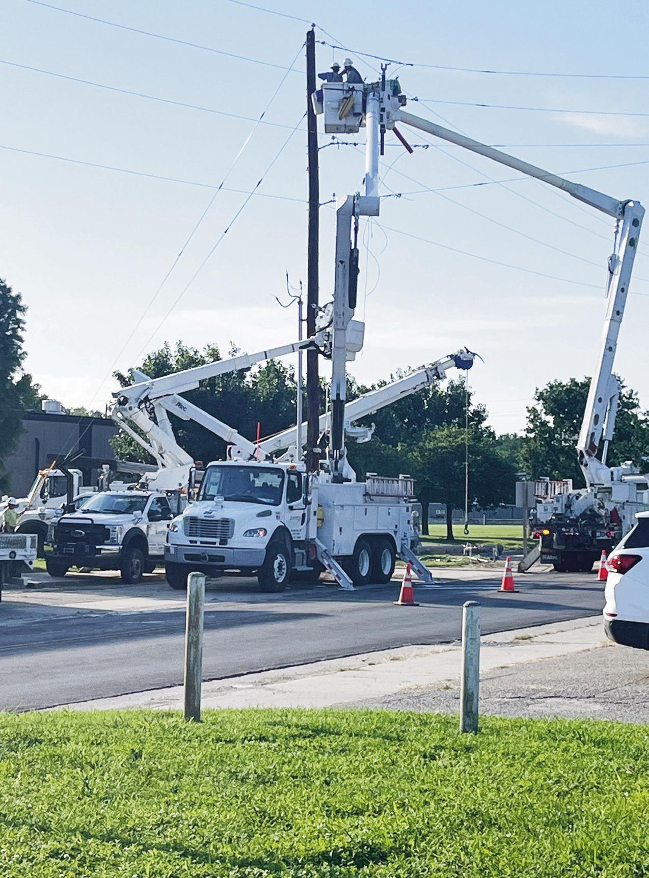 UPDATING INFRASTRUCTURE . . .Evergy has been updating power poles in the Council Grove area. The workers in the photo were installing a new pole on the west side of Council Grove Junior Senior High School.