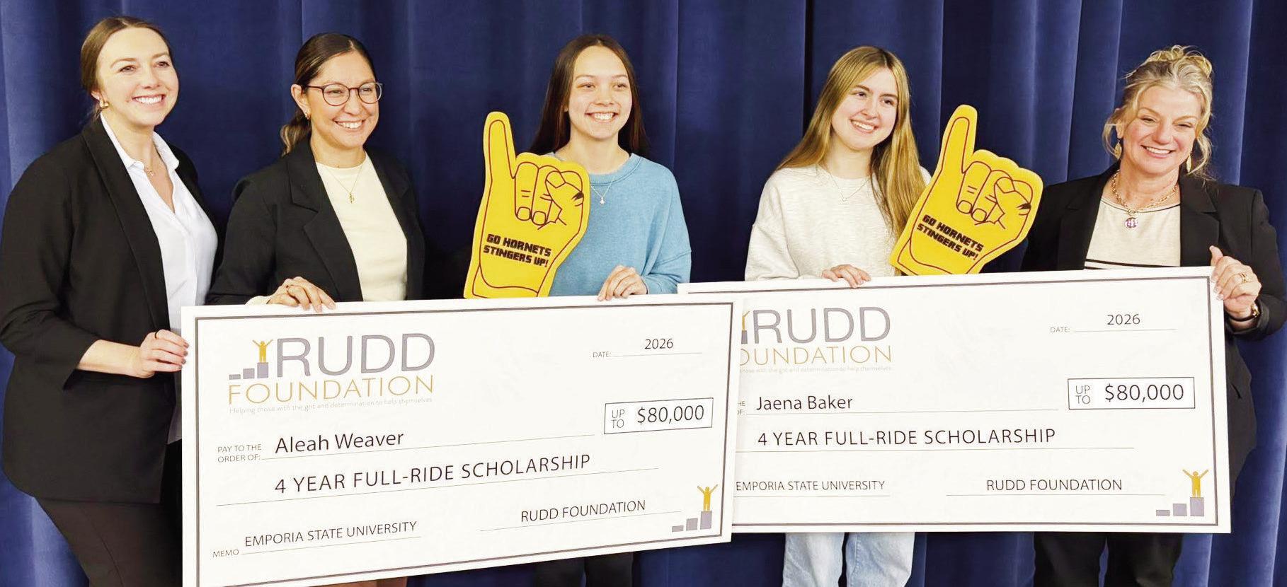 BIG SCHOLARSHIPS - Aleah Weaver (center left) and Jaena Baker (center right) have earned 4 year fullride scholarships from the Rudd Foundation. The presentation of checks representing $80,000 each was made Friday with representatives of the foundation pre
