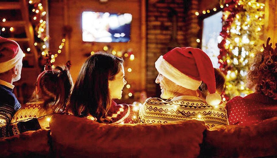 Watching holiday movies is a beloved American Christmas tradition. (Photo courtesy of skynesher / E+)