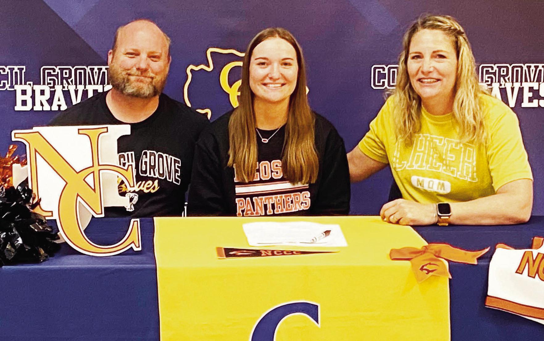 CHEERING INTENT . . . Faith Blosser signed a National Letter of Intent to Cheer at Neosho County on Monday. Pictured with Faith are her parents, Jesse Blosser and Tabitha Barrett.