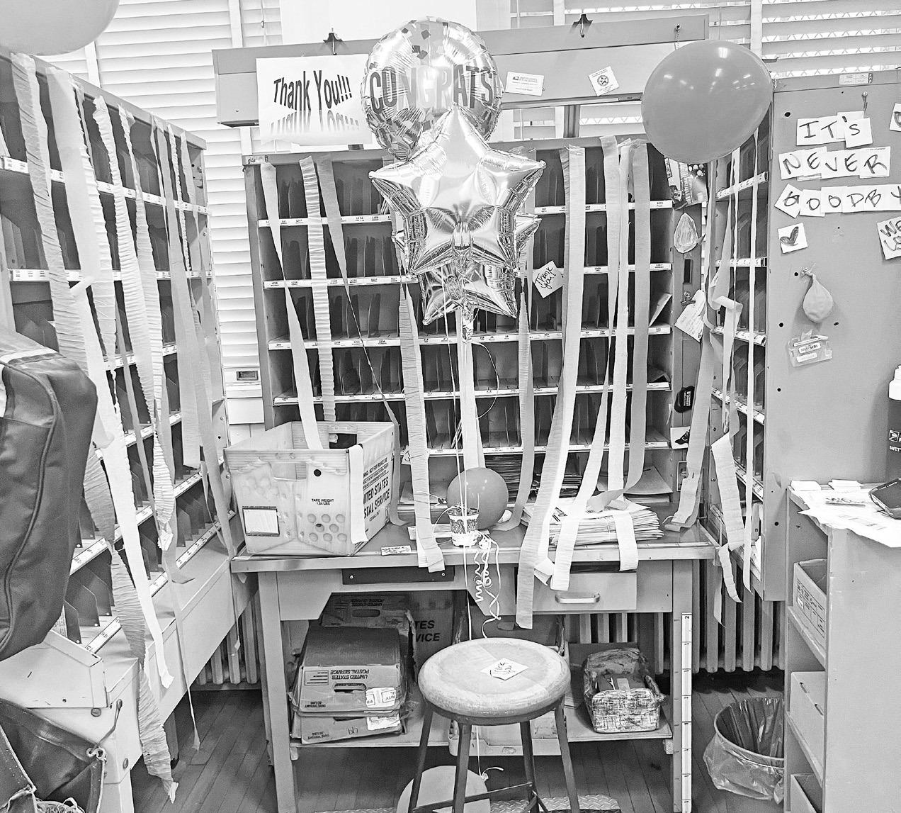 RIFFEL RETIRING AFTER 29 YEARS -- Ken Riffel (left) was all smiles this morning as his USPS co-workers celebrated his 29 years of service by decorating his work sorting area (above). Riffel’s last day of service is Friday.