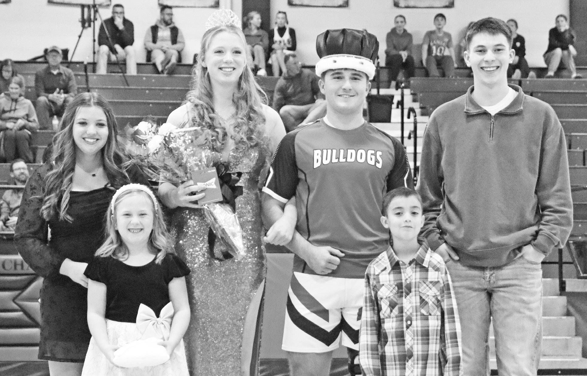 Chase County High School celebrated its Winter Court on Friday, December 19. Cair Paravel won the boys game 60-39, while the Chase County Lady Bulldogs won their game 40-37. Pictured from left to right are: Alumni Avery Beyer, Queen Madelyn Wilson, King G