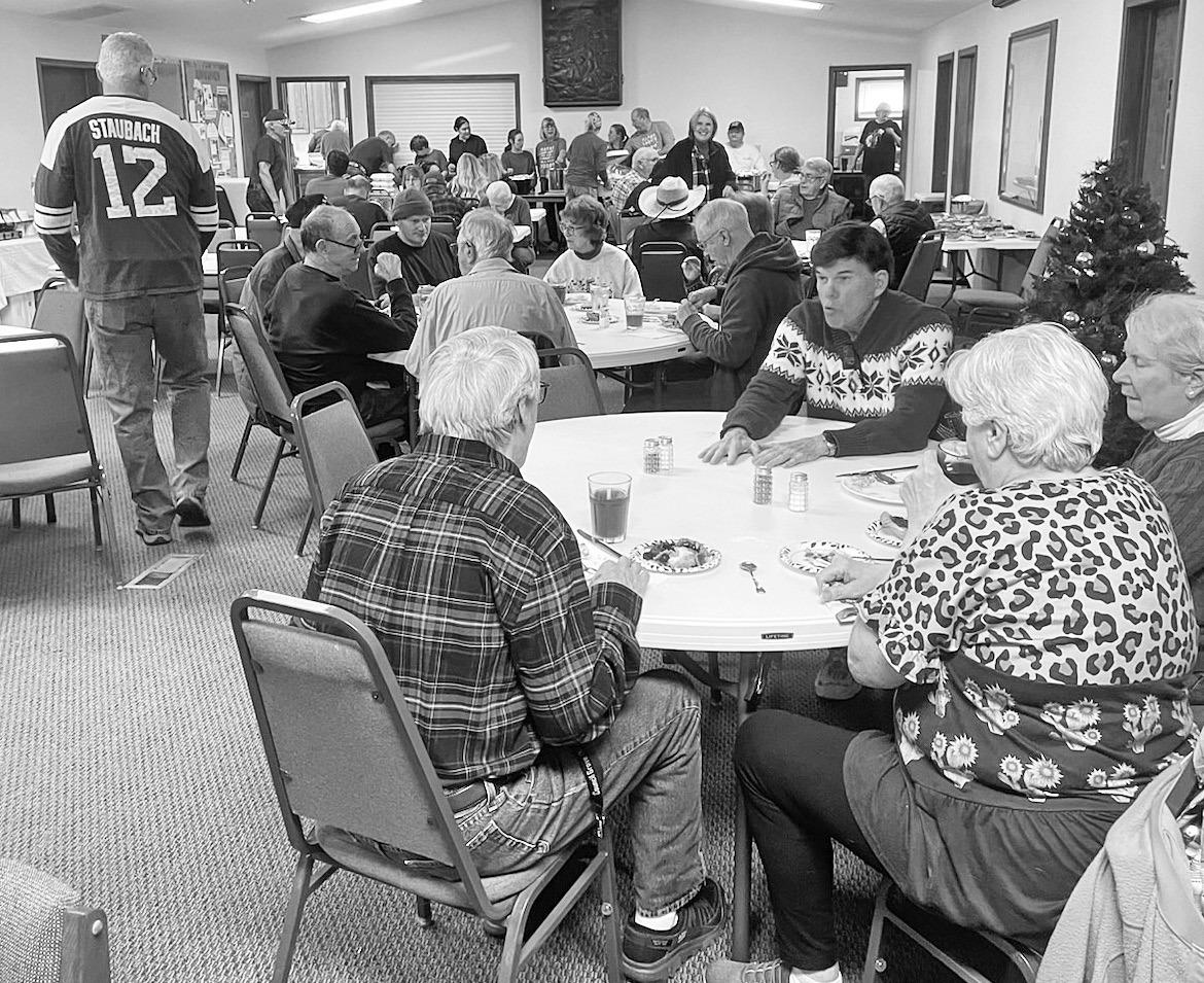 A few of the many area residents who opted to enjoy First Baptist Church’s Community Christmas meal are pictured above. Nearly 300 dined in, carried-out or had the holiday meal delivered to them.