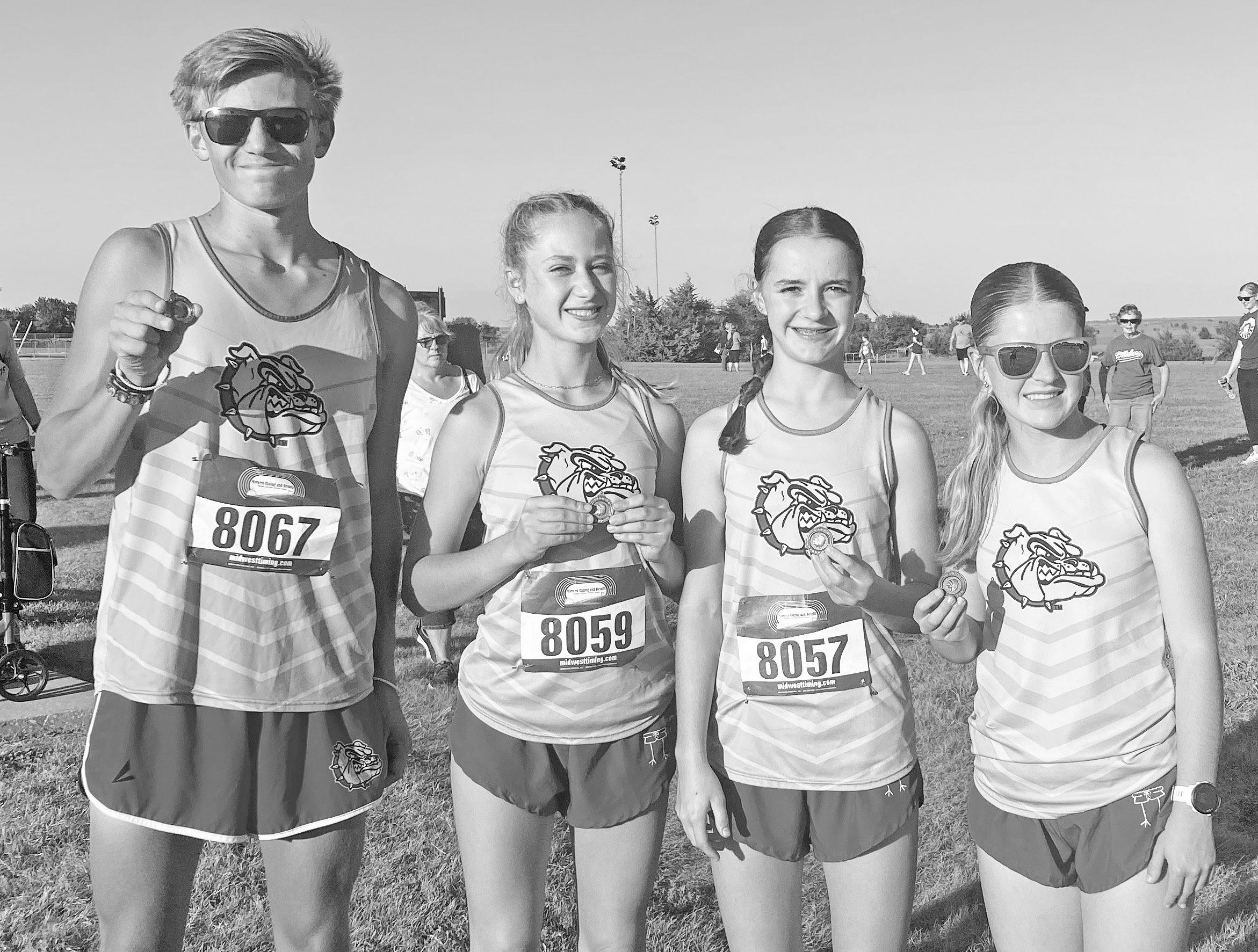 COMPETE WELL AT MARION -- Chase County Cross Country ran at Marion on Thursday. John Paul Ubert medaled 10th with a seasonal best time of 18:28. Easton Murphy ran a PR for the men’s team. Sadie Mushrush medaled 20th for the varsity women and Clara Patte