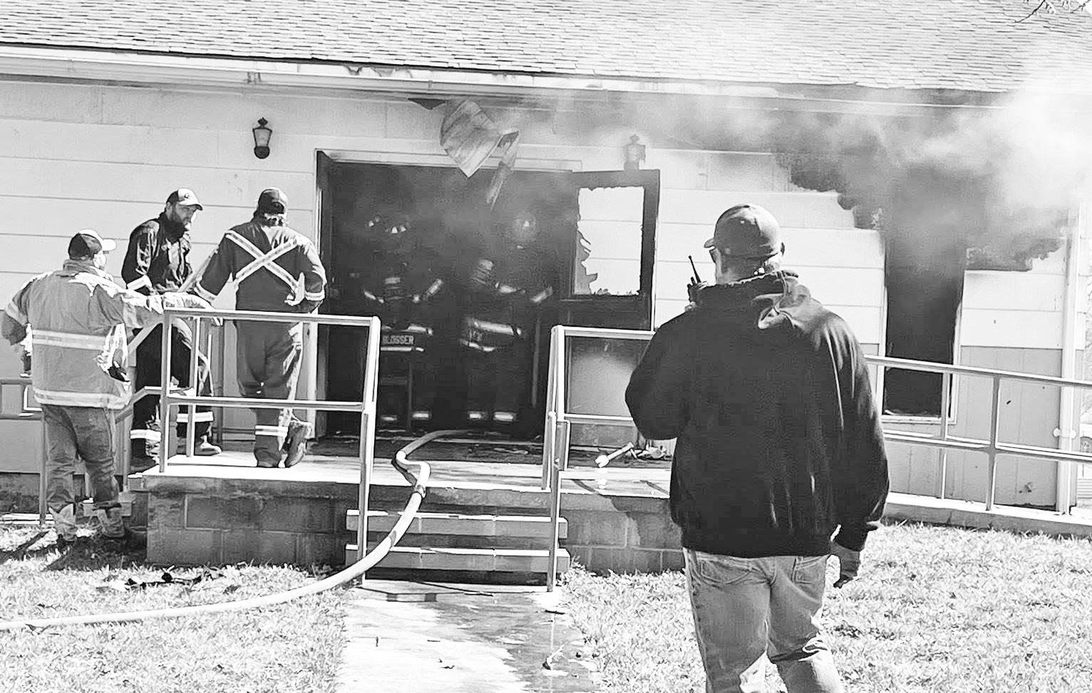 Firefighters can be seen in the doorway assessing the status of the fire. Water was pumped to the fire from the intersection of Huffaker and N. Mission. (Photo by Rebekah Kryger)