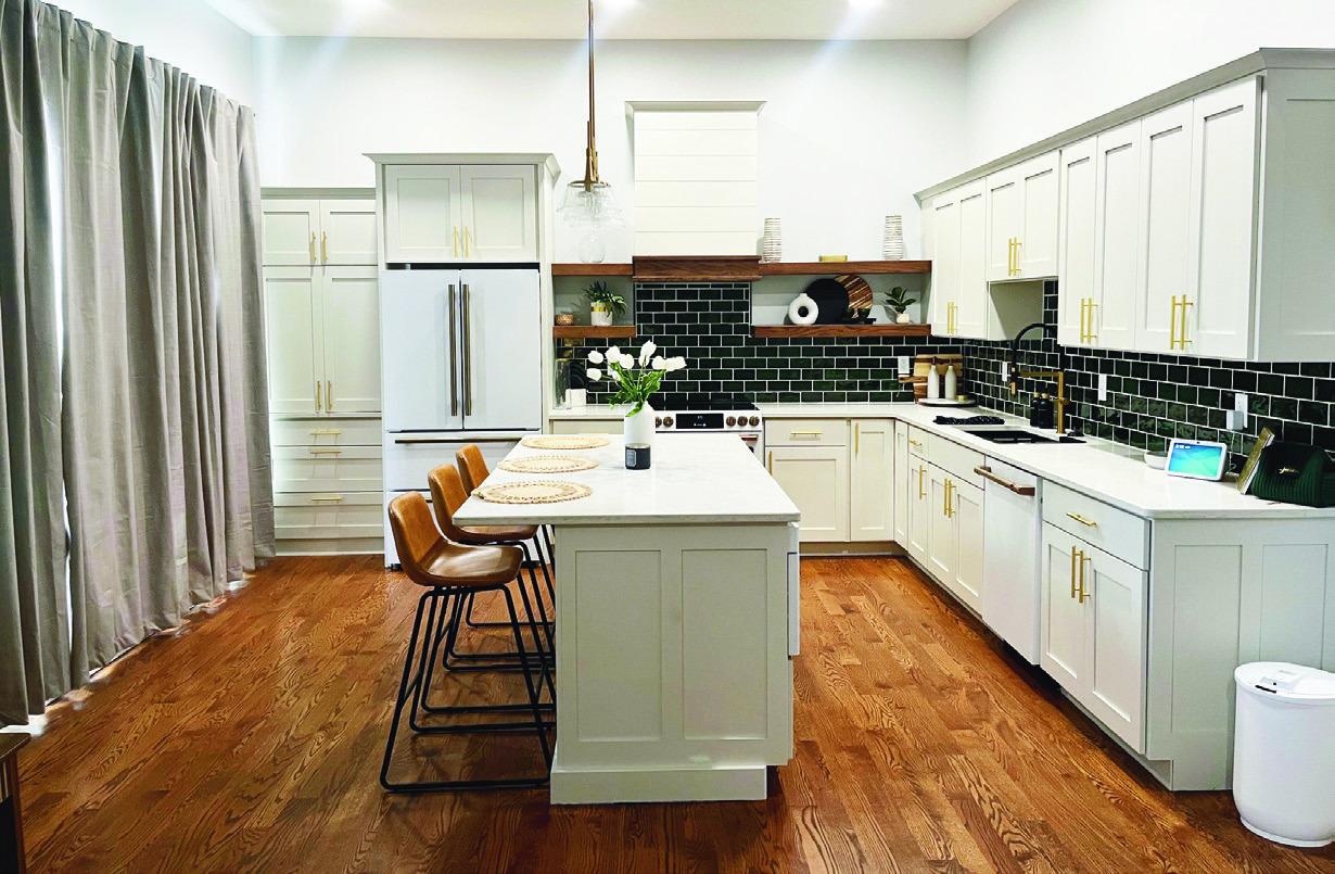 A LUXURY APARTMENT AWAITS . . . Jacie Gunter joked that the two bedroom loft flapartment cost as much as a nice home in Kansas City. Above is a view of the kitchen, which is facing west, with the windows overlooking Main Street on the left.