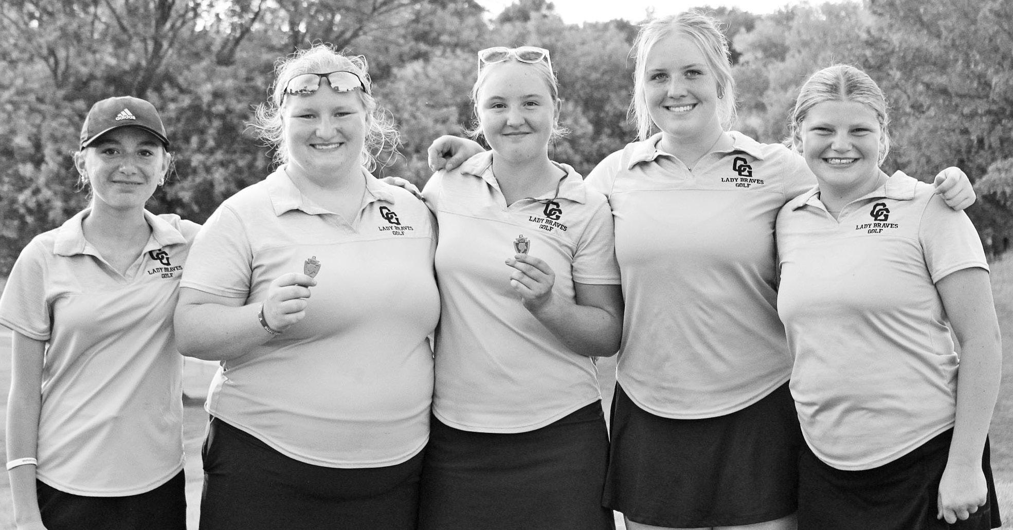 HOME JV INVITATIONAL GOLF CHAMPS -- The Lady Braves took first place Tuesday, at the Council Grove Junior Varsity Invitational Golf Tournament. Members of the winning team pictured are (L to R): Milo Nelson, Emily Teter, Desiree Bachura, Olivia Kennedy an