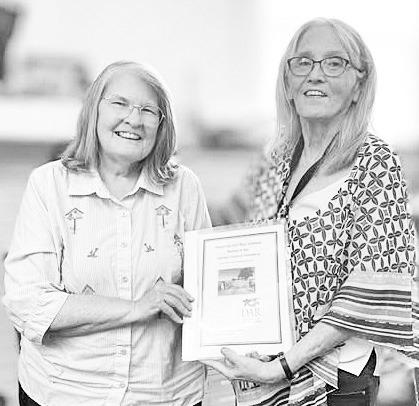 Jan Koepke (left) presents her research project about seven black Civil War solders buried at the Dunlap Colored Cemetery to Morris County Historical Society representative Jan Kimbrell.