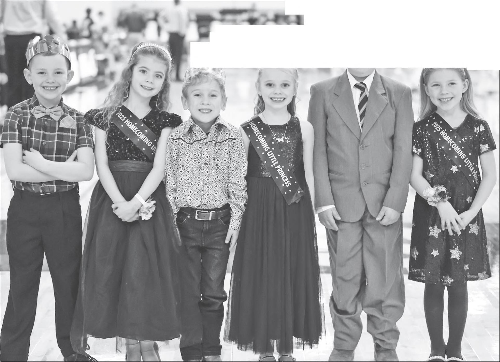 CORONATION CEREMONY HELPERS — Little People helping with the flowers and crowns Friday night during the Winter Homecoming coronation ceremony at Council Grove High School were (L to R): Wallace Yoder, Kara Hemmy, Declan Alvarez, Rylie Liddick, Bryson Be