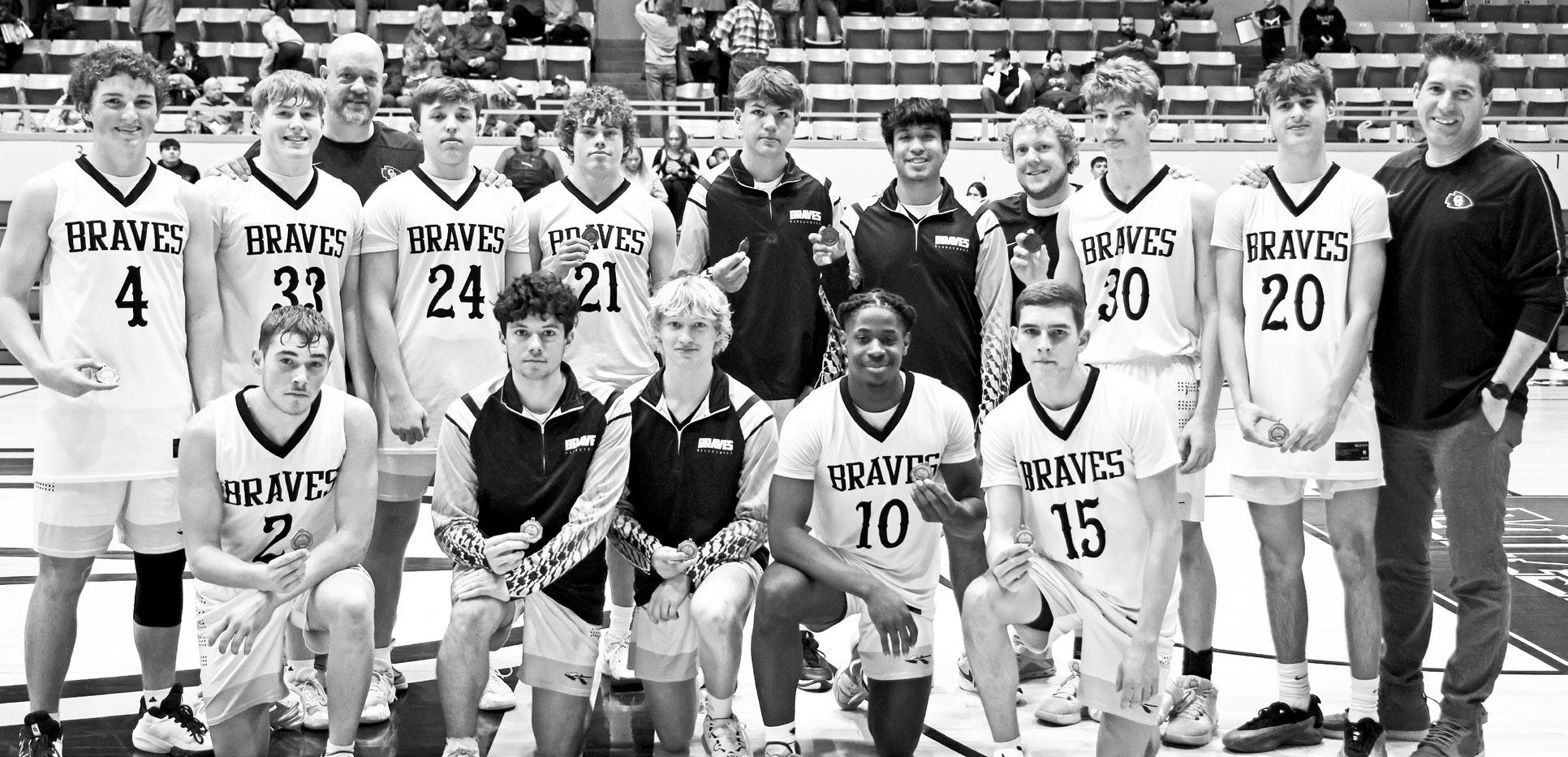 ADVANCING . . .The Council Grove High School Braves are advancing to the sub-state #2 championships and will play Hesston, after defeating Nemaha Central 64-58 on their home court. Pictured are - Back Row (L to R): Drew Buchman, Reid Buttrey, Coach Bruce 