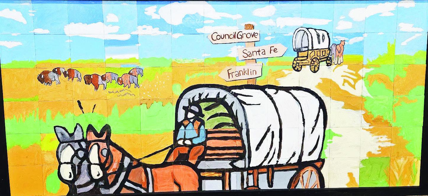 CELEBRATING COUNCIL GROVE’S BICENTENNIAL and hosting of the Santa Fe Trail Symposium, a mural named “Trail Cruise” was designed by Mary Yoder and completed by Art Camp attendees with touch ups by Yoder, Sabra Schweger and Riley Scott. The mural will