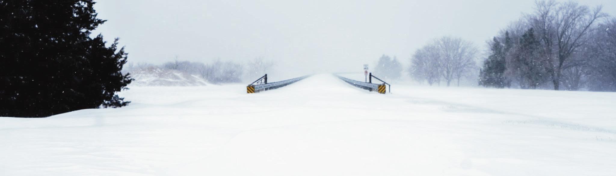 TREACHEROUS CROSSING -- City of Council Grove Police Chief Shawn Wangerin captured a snowy impassable dam road before it was officially closed.