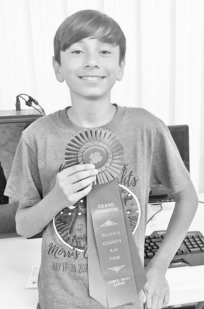 SAVING TO INVEST . . . Former newspaper carrier Marcello Balboa used his route money to buy parts to build computers. He is shown on July 26, 2021 at the Morris County 4-H Fair where he earned Grand Champion for his efforts.