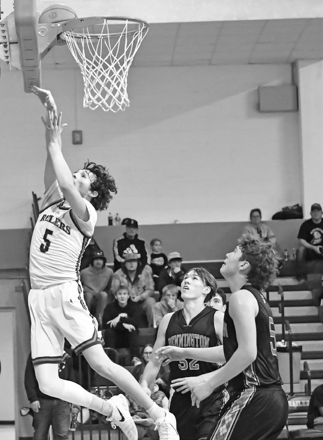 Herington High School junior Cameron Strauss (5) leaps up for a basket in last Thursday’s non-league basketball game. The Railers hosted Bennington High, with the Bulldogs earning the win, 55-25. (Photo by Susan Mueller)