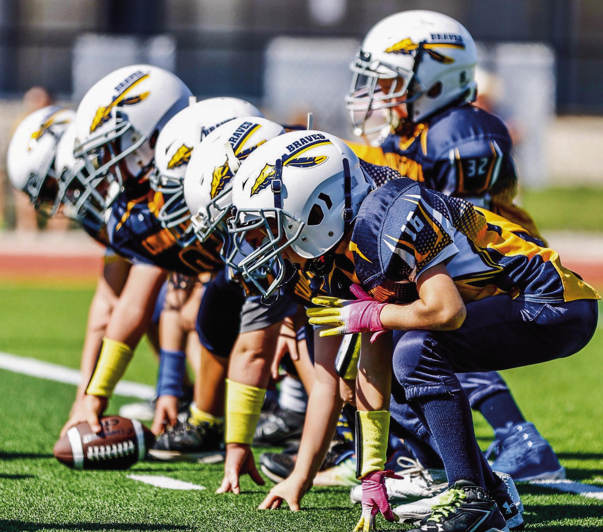 TODAY’S YOUTH LEAGUE PLAYERS, TOMORROW’S FRIDAY NIGHT STARS -- Council Grove’s 3rd and 4th graders are building the foundation for the future of Braves football. (Photo by Amber Weeks)