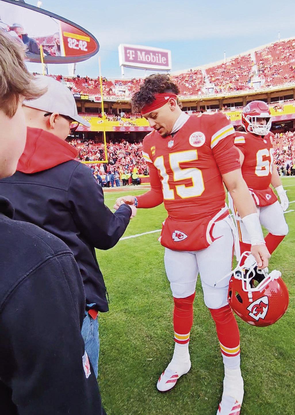 SHARING THE FIGHT -- Ethan Lif, a Council Grove youth fighting cancer, was a guest of the Kansas City Chiefs at the playoff game Sunday. He was presented with a game ball from quarterback Patrick Mahomes and had the opportunity to give Mahomes one of his 