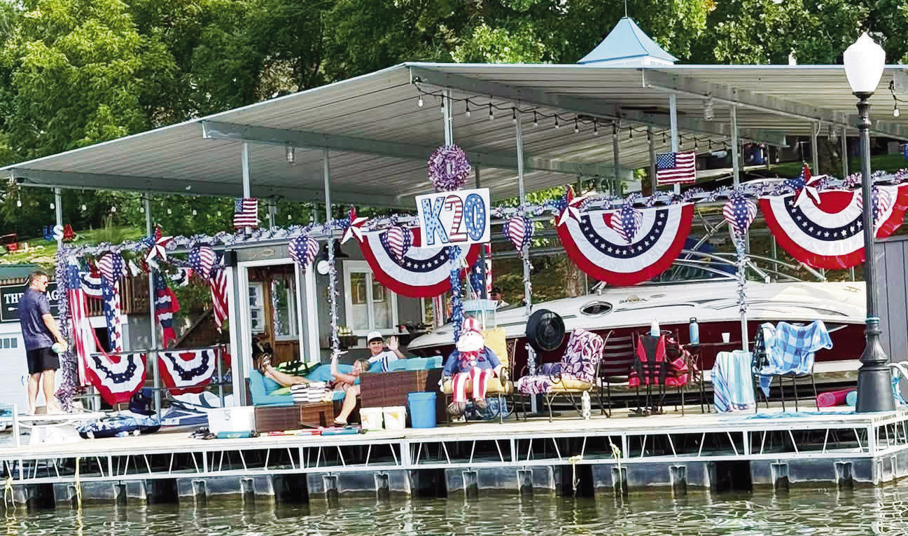 A patriotic-themed boat above won the Council Grove Lake Regatta while the festive K20 site won the Lakefront Decorating contest. Both contests were sponsored by the Council Grove Lake Community Association.