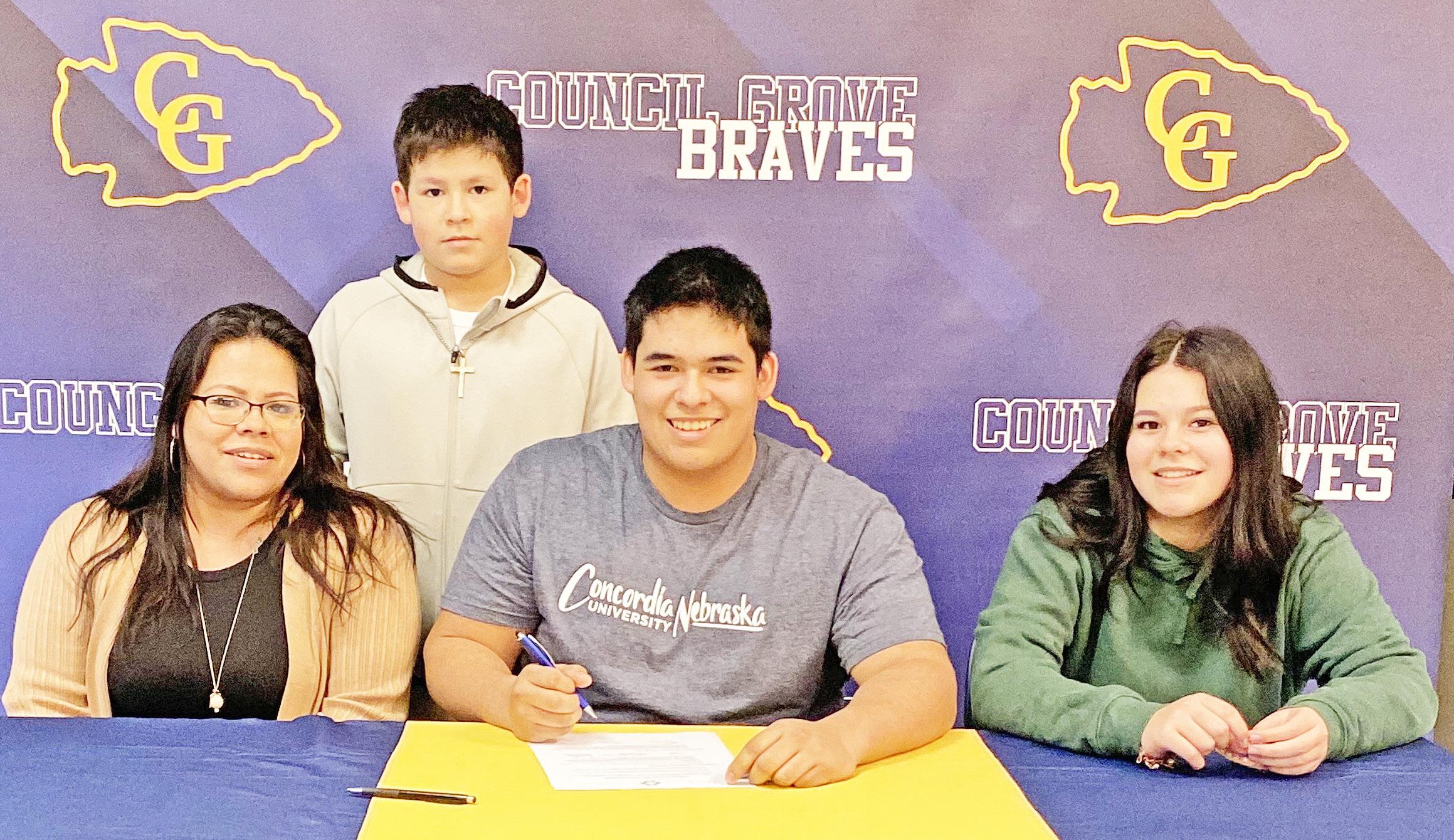 PLAYING AT CONCORDIA . . . Last week, AJ Rocha signed his National Letter of Intent to play football at Concordia University. Pictured with Rocha are his mother Brenda Lesher and his siblings Christopher Peterson and Hannah Peterson.