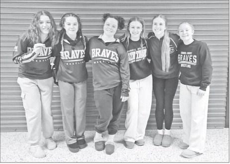 STATEBOUND. . . Six Council Grove Lady Braves wrestlers qualified for state competition Saturday when they excelled at a regional tournament in Rossville. Pictured left to right are: Savanah Johnson, Briley Cannon, Brenah Cannon, Alysia Werner, Lainie Joh