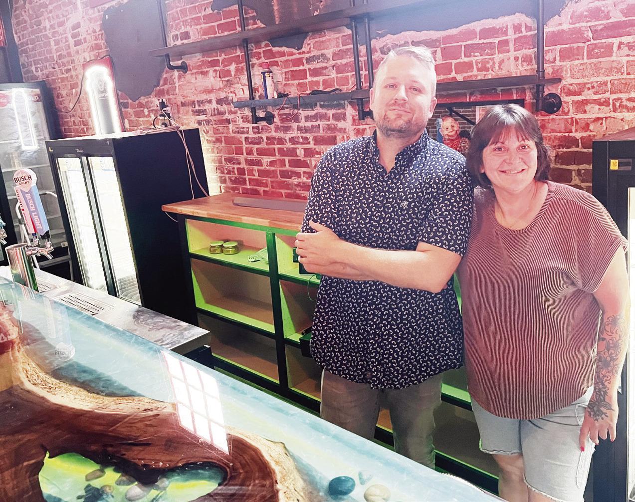 Frankie Greco and Maesha Pool paused from their work Monday, as they readied the Cut &amp; Chute Bar, which is scheduled to open Friday, May 29. at 200 W. Main in Council Grove.