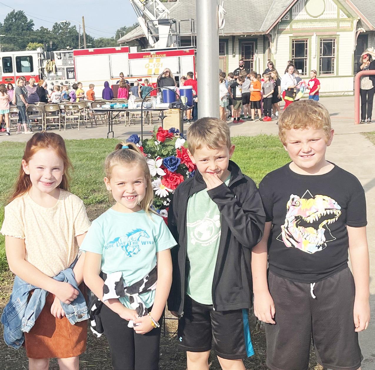 LAY WREATH IN HONOR OF VICTIMS -- The annual Patriot Day Ceremony was held at the Council Grove Fire Station and attended by approximately 120 students from the 2nd, 3rd and 4th grade of Council Grove Elementary School. As part of the ceremony, students, 
