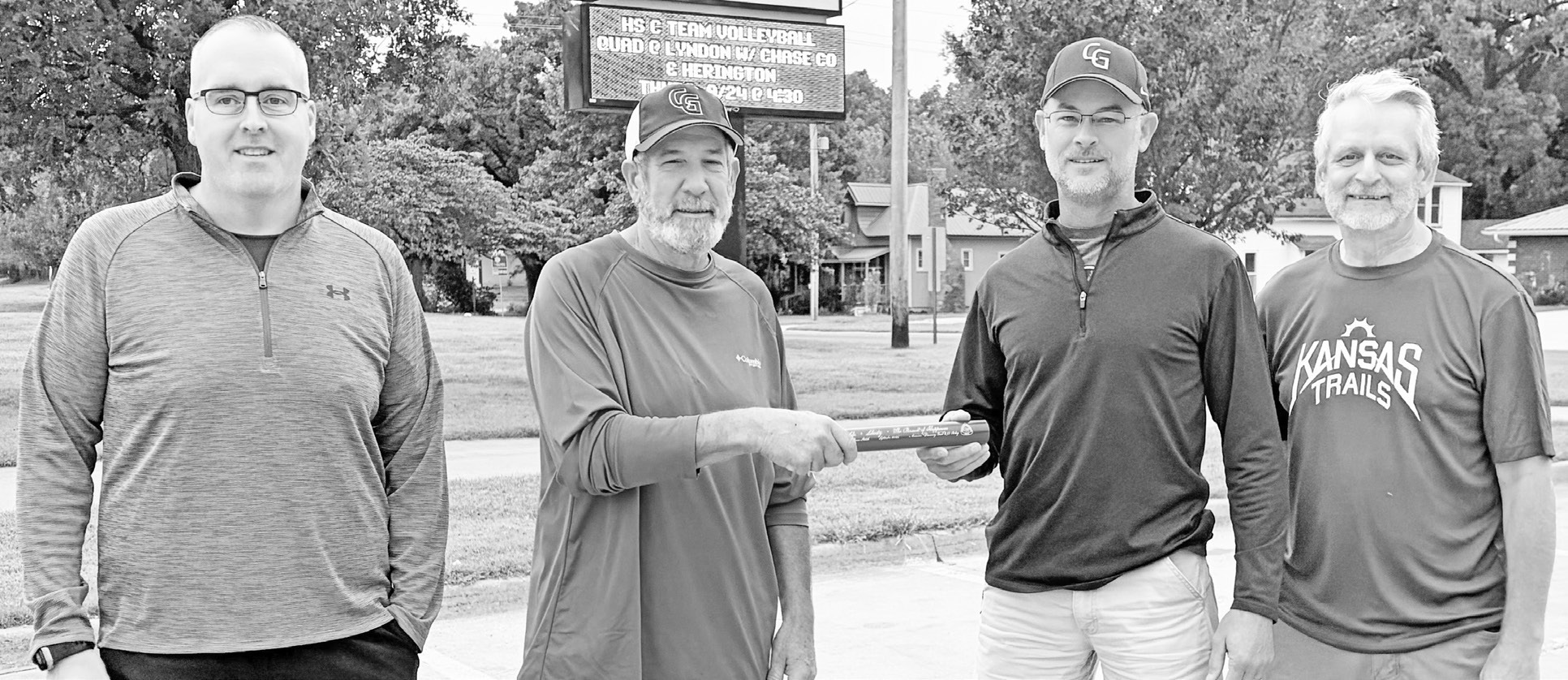 Community leaders participated in an official Discovery 250 Relay sendoff Tuesday morning. Picture are (L to R) Council Grove City Administrator Nick Jones, County Commissioner Dave Fox, Council Grove Mayor Ryan McDonald and Executive Director of Kansas Trails Mike Scanlon. McDonald was seen carrying the baton on the Flint Hills Trail.
