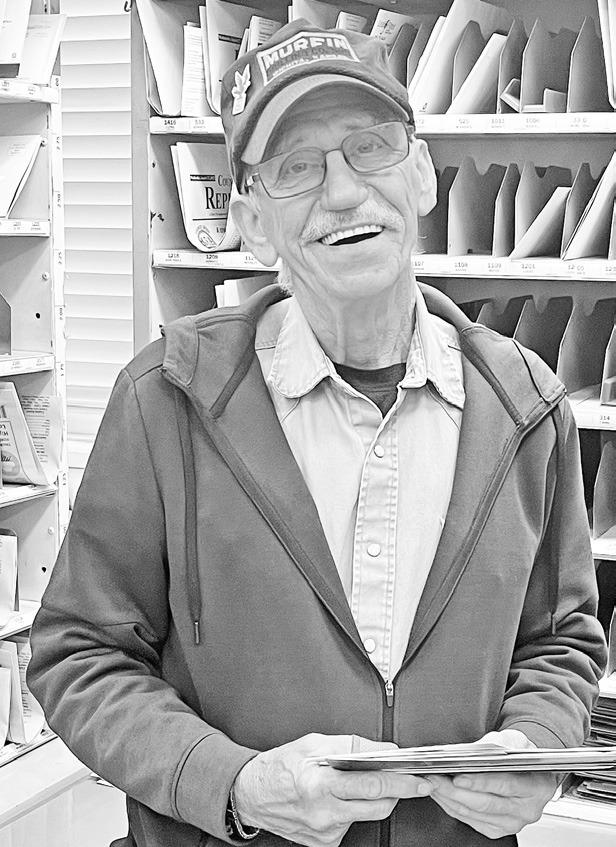 RIFFEL RETIRING AFTER 29 YEARS -- Ken Riffel (left) was all smiles this morning as his USPS co-workers celebrated his 29 years of service by decorating his work sorting area (above). Riffel’s last day of service is Friday.