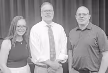 Kansas Supreme Court Justice Caleb Stegall (center) spoke to juniors and seniors on Tuesday at a forum in the CGJSHS Auditorium. Pictured with Stegall are his daughter-in-law Amber Bacon Stegall, who is a 2015 graduate of Council Grove High School and Jay