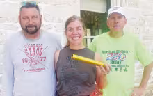 Bill and Katie Allen of Manhattan provided an important link in the nationwide Discovery 250 Relay on Monday, carrying the baton from Herington to Council Grove by bicycle. After receiving the baton in Herington, the couple rode to Council Grove, where they handed it off to relay coordinator Mike Leland (right). The baton leaves Council Grove early this morning, traveling through Allegawaho Memorial Heritage Park and along the Flint Hills Trail.