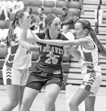 Council Grove eighth grader Declan SanRomani works to get open against two defenders as she goes on to score 10 points against Osage City Monday night. The Junior High Lady Braves were defeated 30-19. Next up for the CGJH is West Franklin at home tonight.