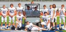 Twelve seniors are in the Council Grove High School Braves football lineup this year. Pictured left to right are: 41 Bradley Doornbos, 43 Mason Bowman, 20 Grady Kepley, 62 Maddox Ziegler, 34 Mason Samuels, Head Coach Derron Reddick, 4 Nate Seimears, 2 Luke Stewart, 14 Sy’ied Smith-Jenkins, 11 Ethan Yowell, 6 Reid Buttrey, 26 David McDiffett and 54 Leo Salas. The Braves open their regular season at home on Friday, Sept. 4, against Mission Valley. (Photo: Keeley Reddick)
