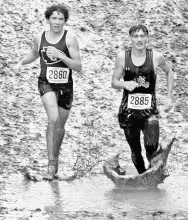 Excelling at navigating mud: Council Grove’s Jayden Picolet (left) placed 5th in the regional race hosted by Wichita Trinity and will now compete in the Braves 3A boys race Saturday. Photo: Lisa Jarvis