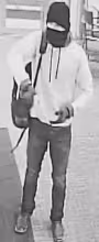 The suspect was last seen wearing a gray shirt, blue jeans, cowboy boots, a black mask, and a black and pink backpack. He fled the scene on