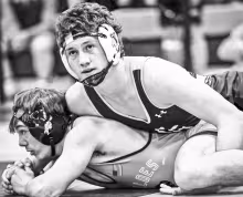 CHAMPION -- Braves senior Cade Honor (33-5) won 2-19 on a tech fall over Monty Meyerekorth of Onaga and went on to win the 165 pound championship. Photo: Amber Weeks