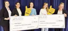 BIG SCHOLARSHIPS - Aleah Weaver (center left) and Jaena Baker (center right) have earned 4 year fullride scholarships from the Rudd Foundation. The presentation of checks representing $80,000 each was made Friday with representatives of the foundation pre