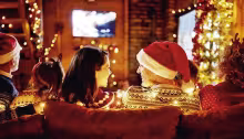 Watching holiday movies is a beloved American Christmas tradition. (Photo courtesy of skynesher / E+)